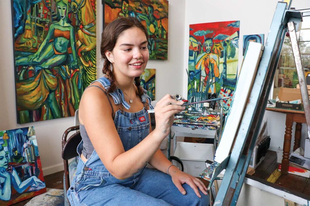 Girl painting at Lowe Mill ARTS & Entertainment