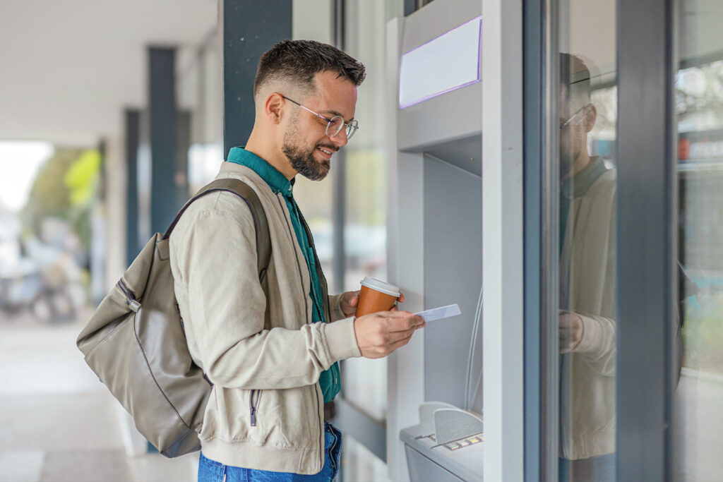 man using ATM