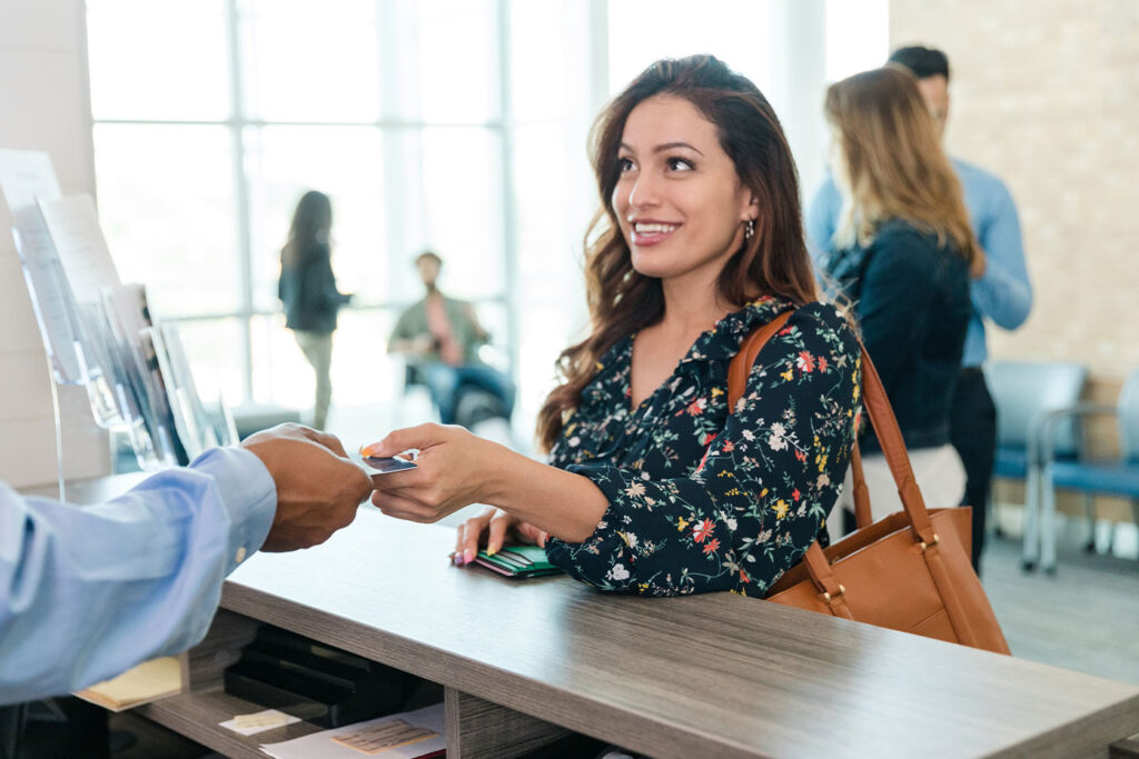 woman at bank interacting with teller