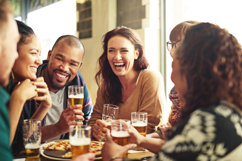 Friends drinking beer and laughing