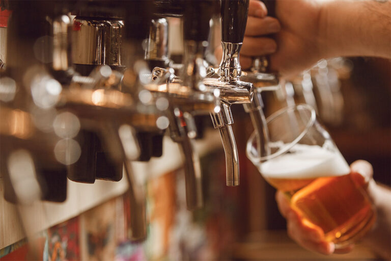 pouring a beer from a tap